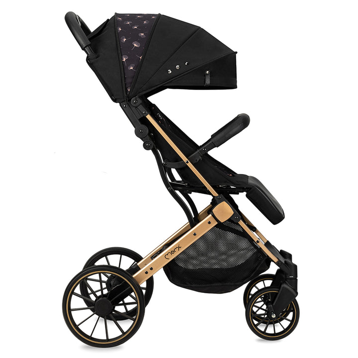 Momi black and gold stroller on a white background