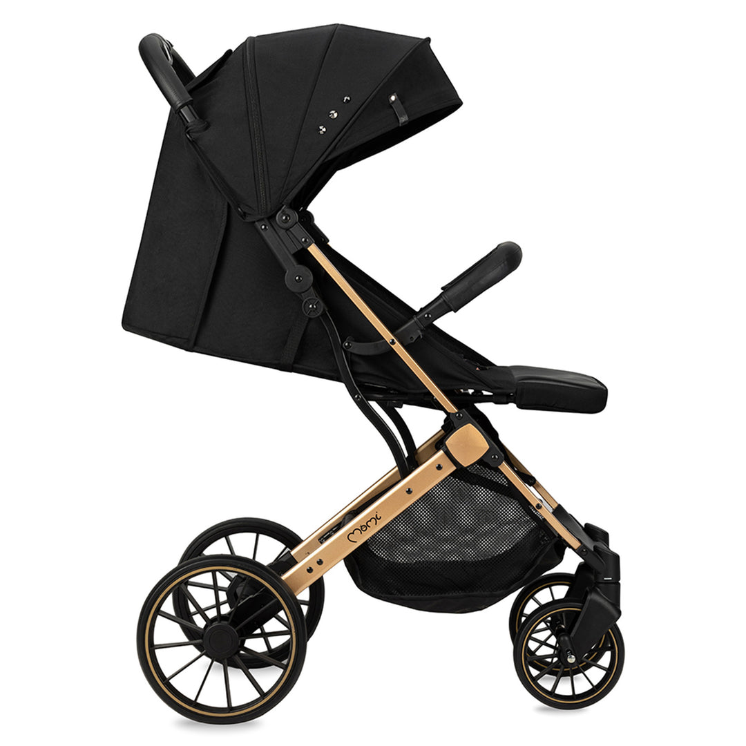 Momi black and gold stroller on a white background