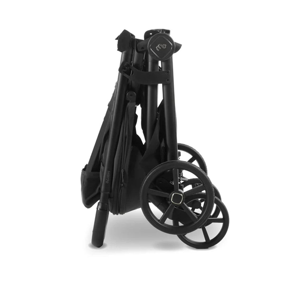 Black folding stroller on a white background