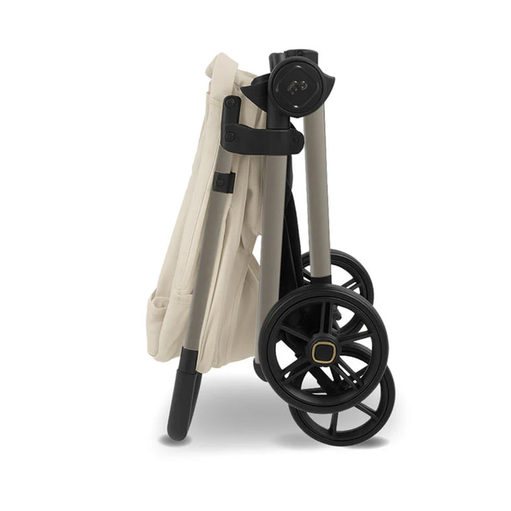 Foldable shopping cart with beige frame and black wheels on a white background