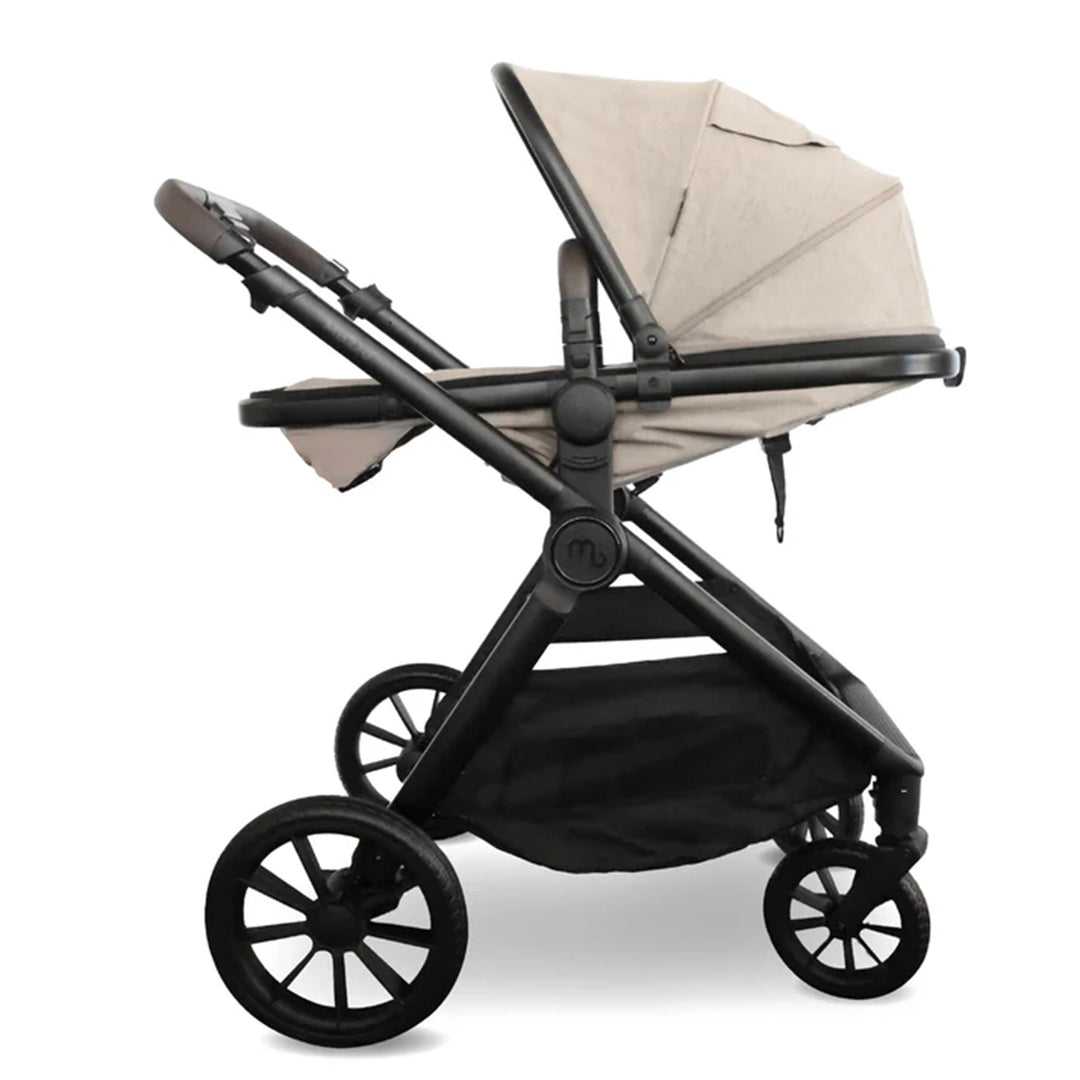 Black stroller with beige canopy on a white background
