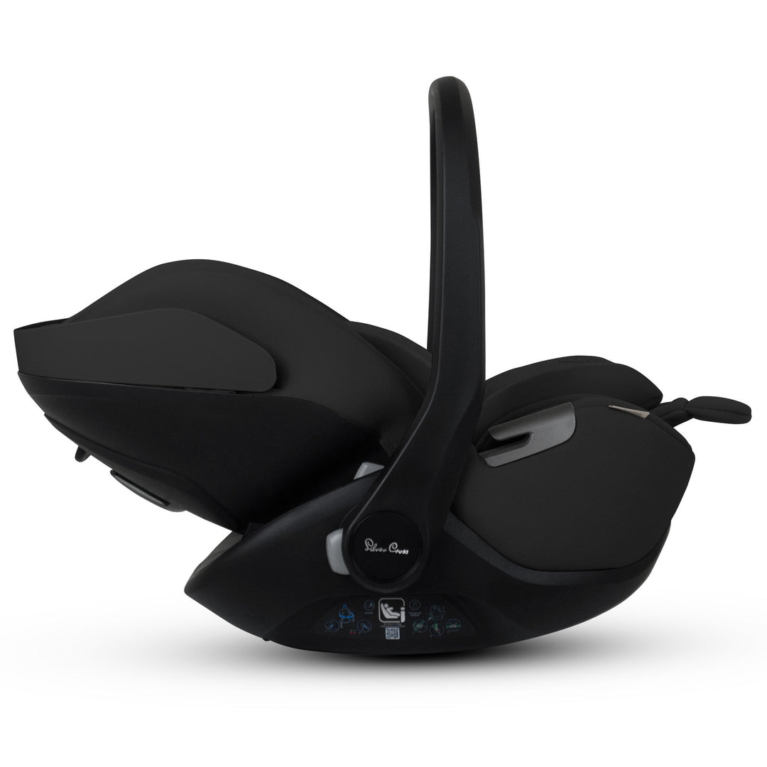 A black Silver Cross Plus i-Size Car Seat, a Red Dot award winner for 2025, designed for children from birth up to 19.5 kg, with dual functionality and a unique inner seat recline system.