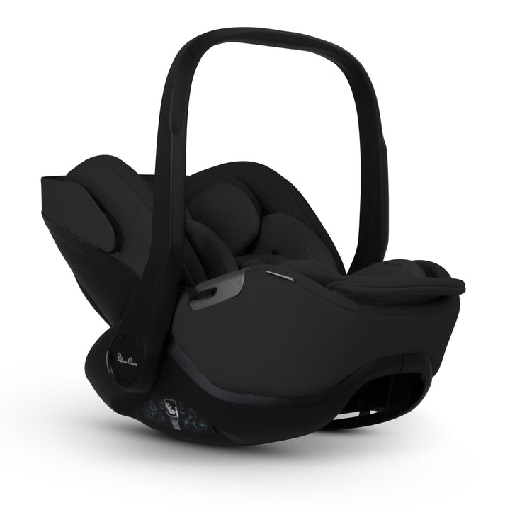 A black Silver Cross Plus i-Size Car Seat, a Red Dot award winner for 2025, designed for children from birth up to 19.5 kg, with dual functionality and a unique inner seat recline system.