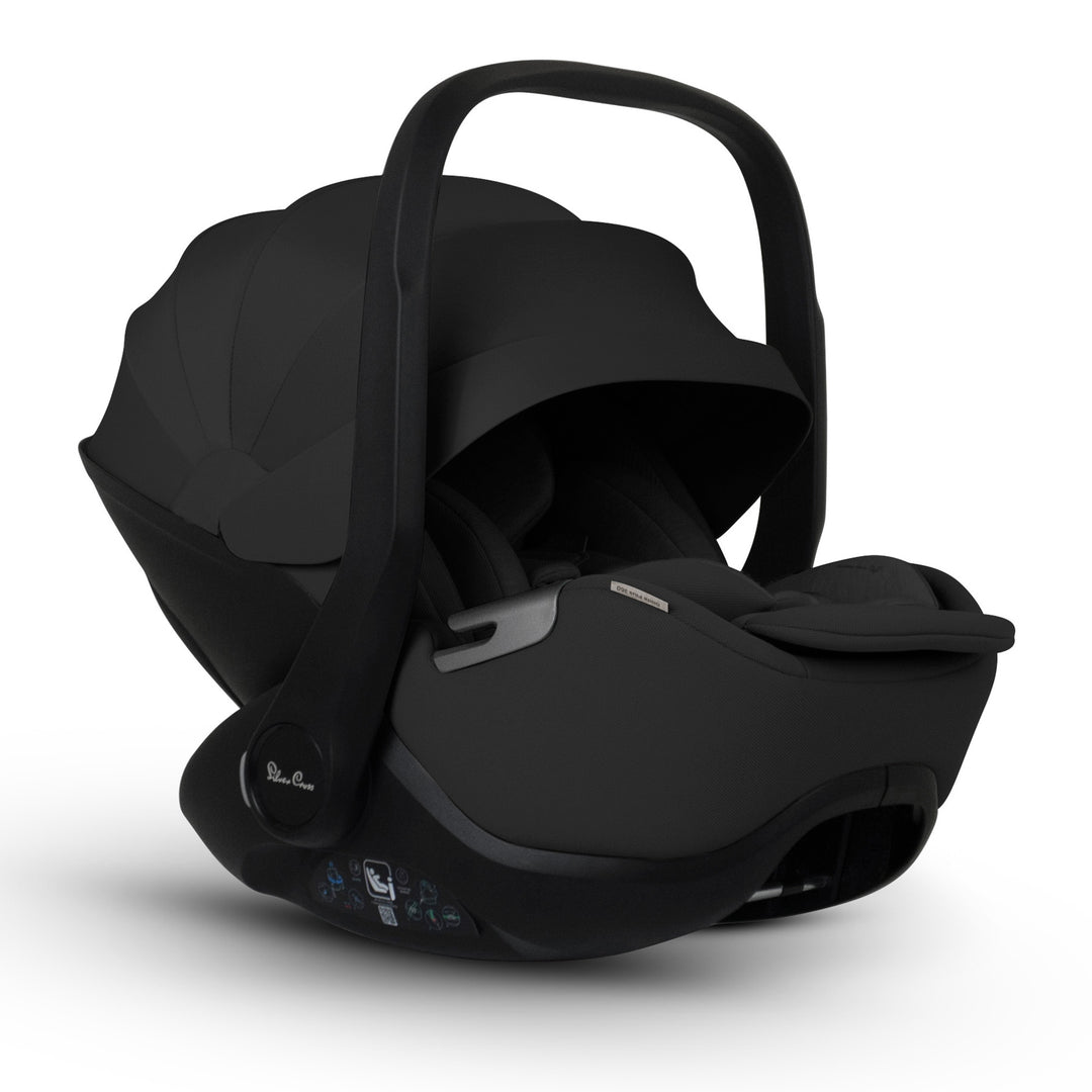 A black Silver Cross Plus i-Size Car Seat, a Red Dot award winner for 2025, designed for children from birth up to 19.5 kg, with dual functionality and a unique inner seat recline system.
