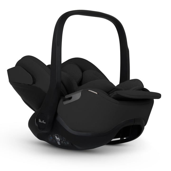 A black Silver Cross Plus i-Size Car Seat, a Red Dot award winner for 2025, designed for children from birth up to 19.5 kg, with dual functionality and a unique inner seat recline system.