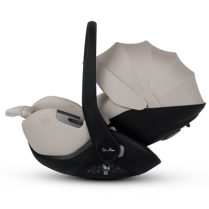 A black Silver Cross Plus i-Size Car Seat, a Red Dot award winner for 2025, designed for children from birth up to 19.5 kg, with dual functionality and a unique inner seat recline system.