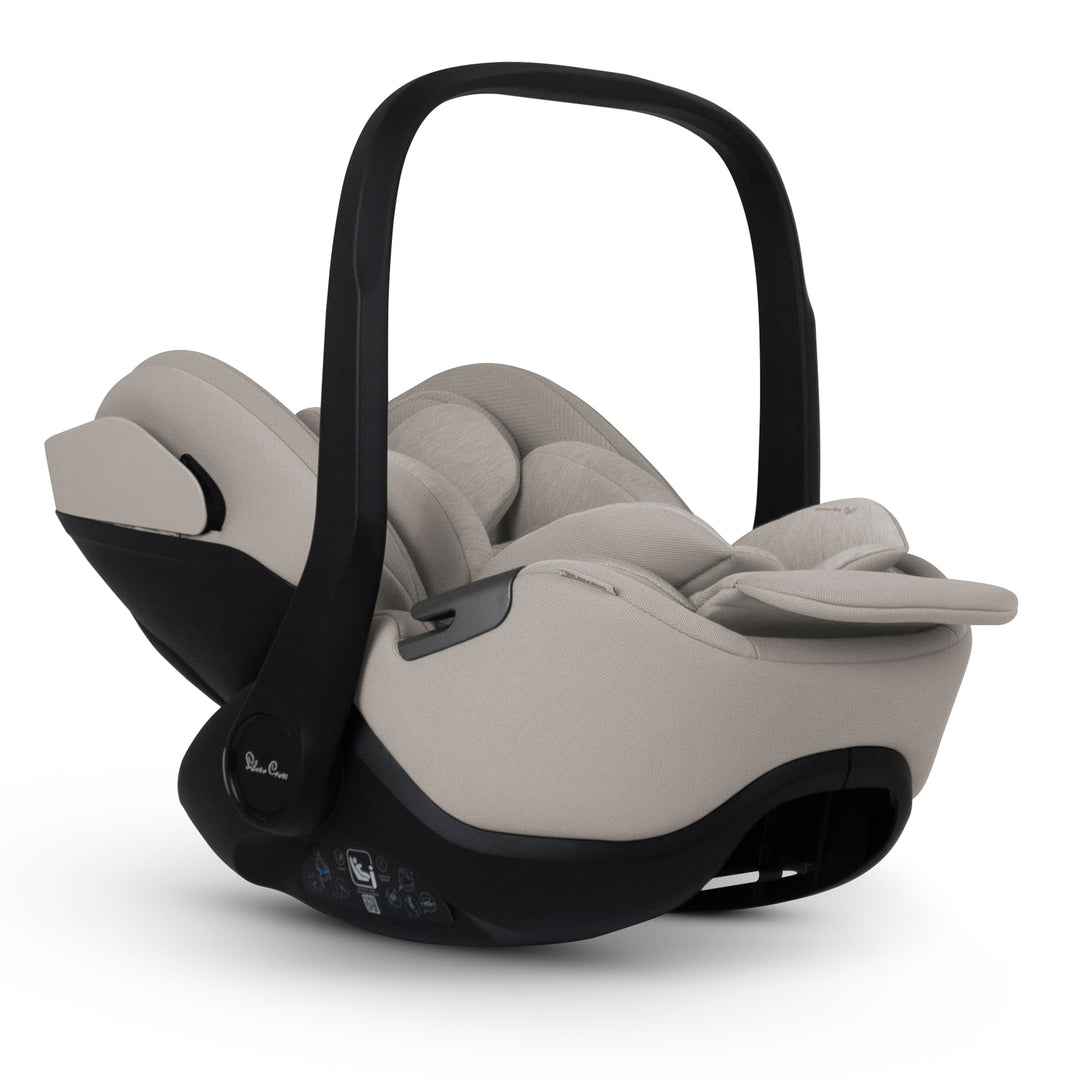 A black Silver Cross Plus i-Size Car Seat, a Red Dot award winner for 2025, designed for children from birth up to 19.5 kg, with dual functionality and a unique inner seat recline system.