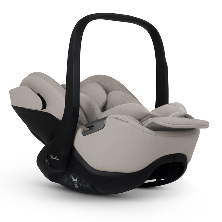 A black Silver Cross Plus i-Size Car Seat, a Red Dot award winner for 2025, designed for children from birth up to 19.5 kg, with dual functionality and a unique inner seat recline system.