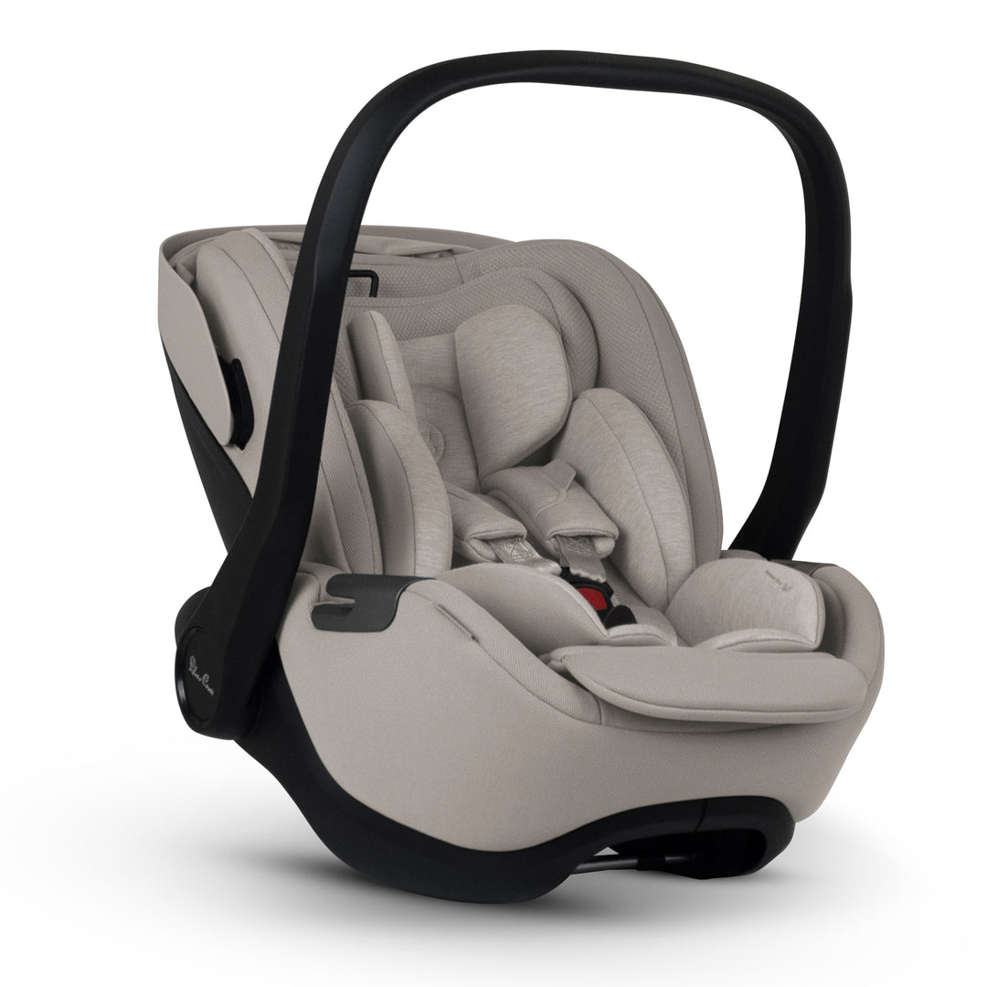 A black Silver Cross Plus i-Size Car Seat, a Red Dot award winner for 2025, designed for children from birth up to 19.5 kg, with dual functionality and a unique inner seat recline system.