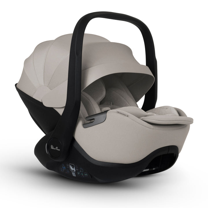 A black Silver Cross Plus i-Size Car Seat, a Red Dot award winner for 2025, designed for children from birth up to 19.5 kg, with dual functionality and a unique inner seat recline system.