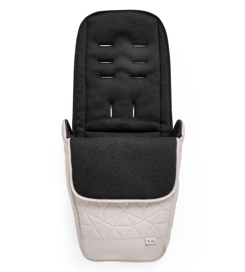 A almond Silver Cross Clic footmuff, featuring a quilted design and magnetic fastenings.