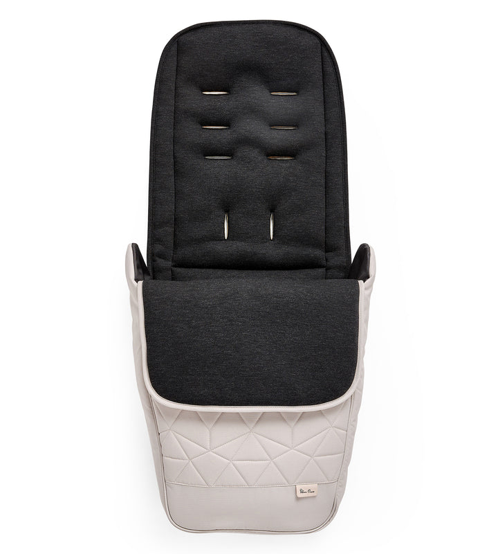 A almond Silver Cross Clic footmuff, featuring a quilted design and magnetic fastenings.