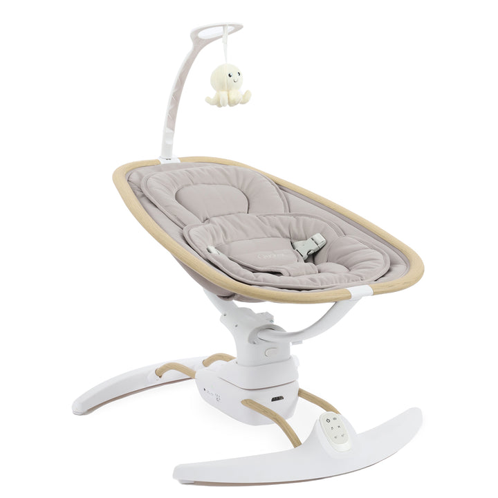 Baby swing with beige cushion and white base on a white background