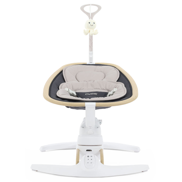 Baby swing with beige cushion and white base on a white background