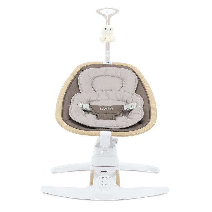 Baby swing with beige cushion and white base on a white background