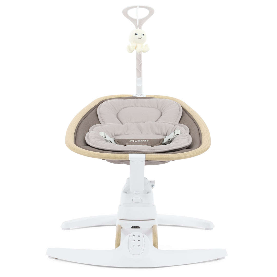Baby swing with beige cushion and white base on a white background