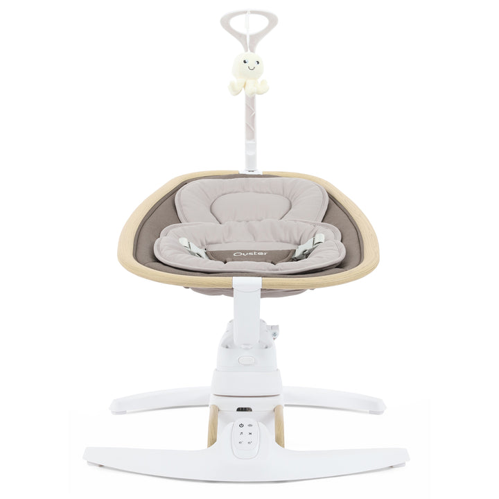 Baby swing with beige cushion and white base on a white background