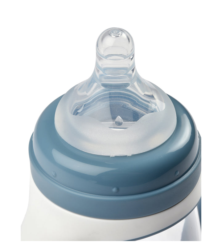 Baby bottle with blue and clear nipple on a white background