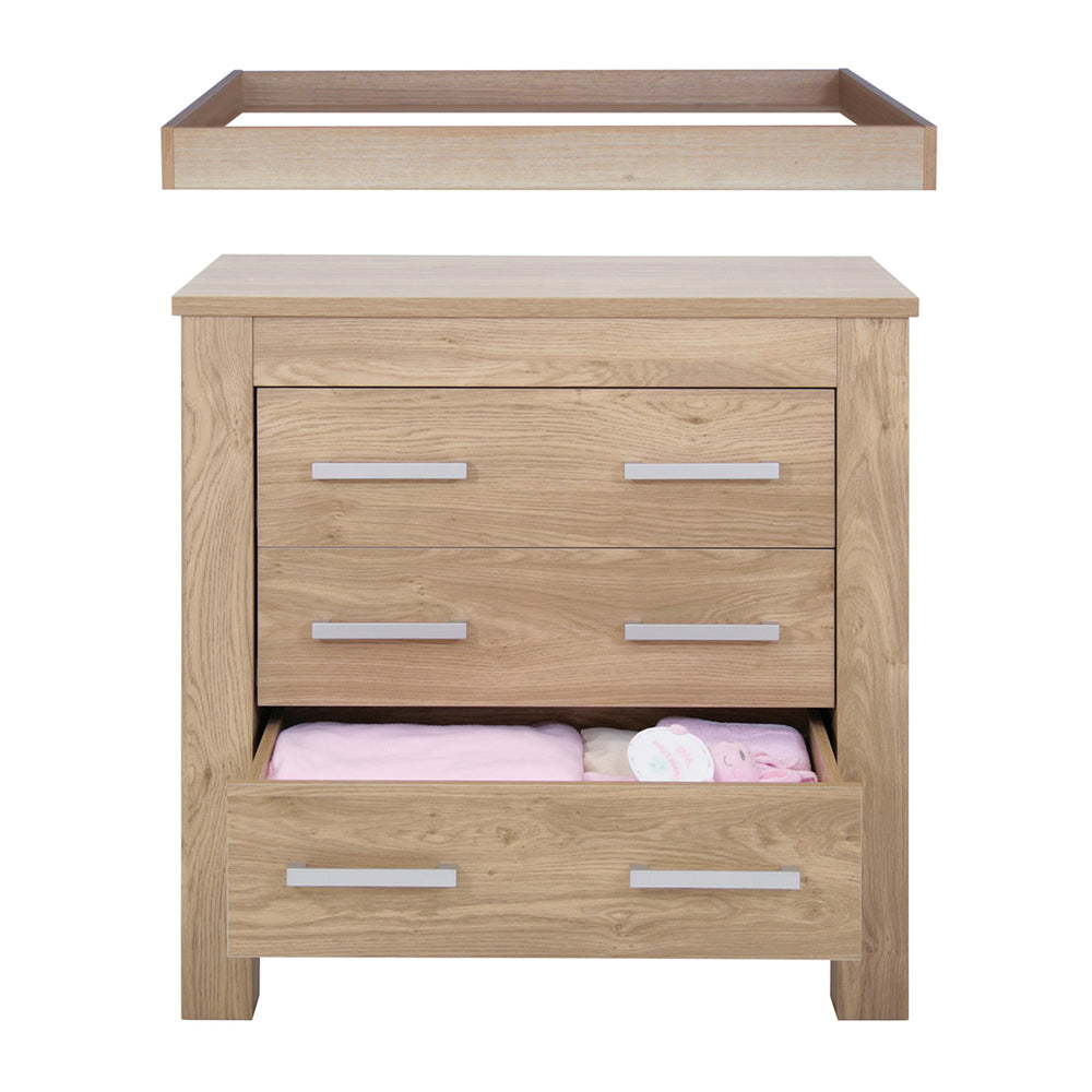 Wooden changing table with drawers on a white background