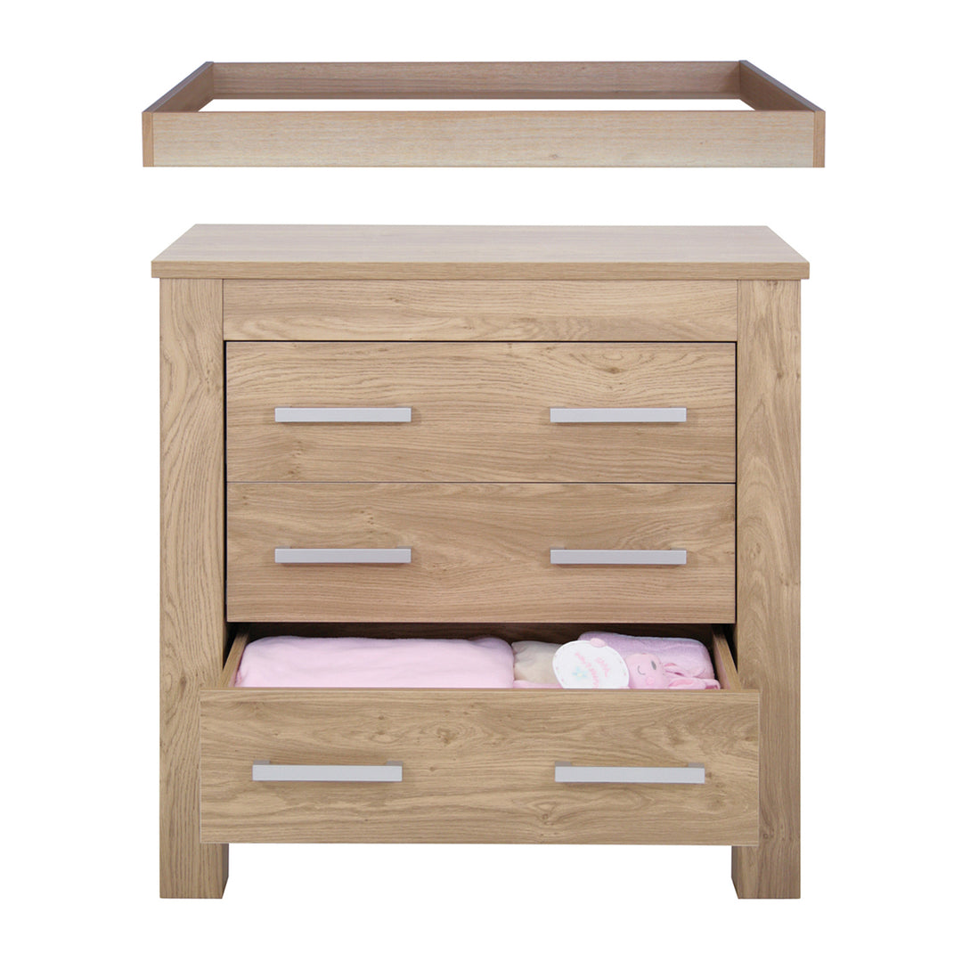 Wooden changing table with drawers on a white background