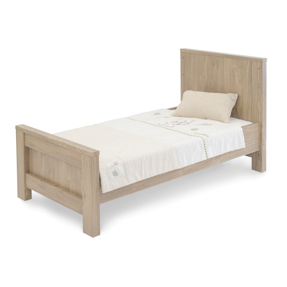 Wooden bed with white bedding on a white background