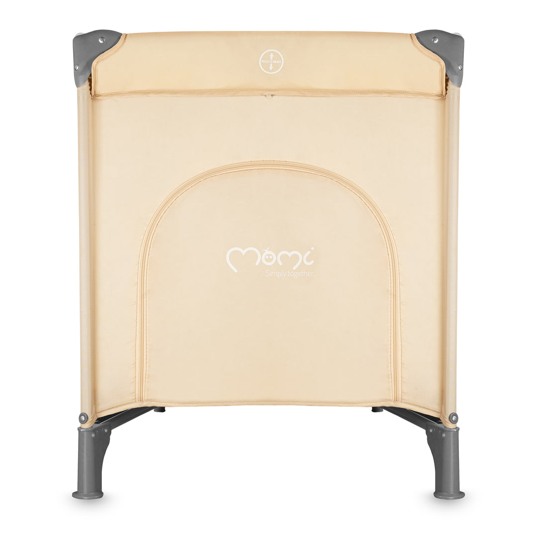 Beige baby crib with gray legs on a white background