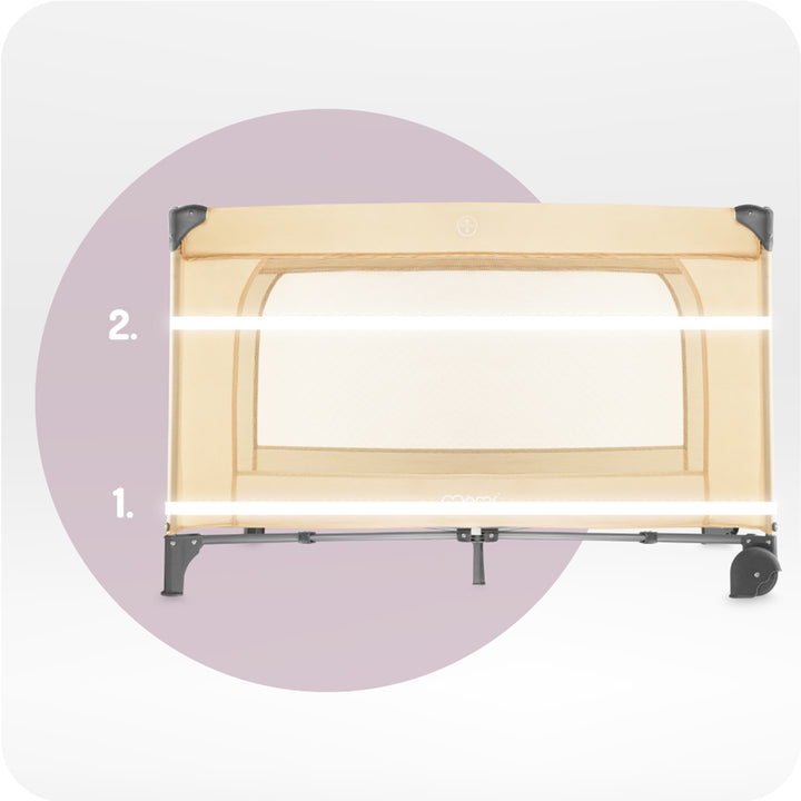 Wooden baby crib with mesh side panel on a white background