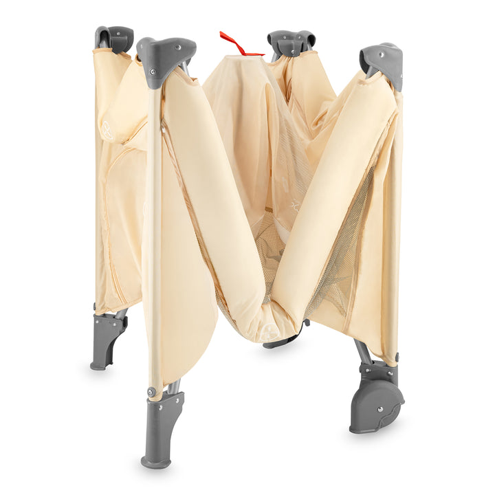 Foldable baby stroller with beige cover and gray frame on a white background