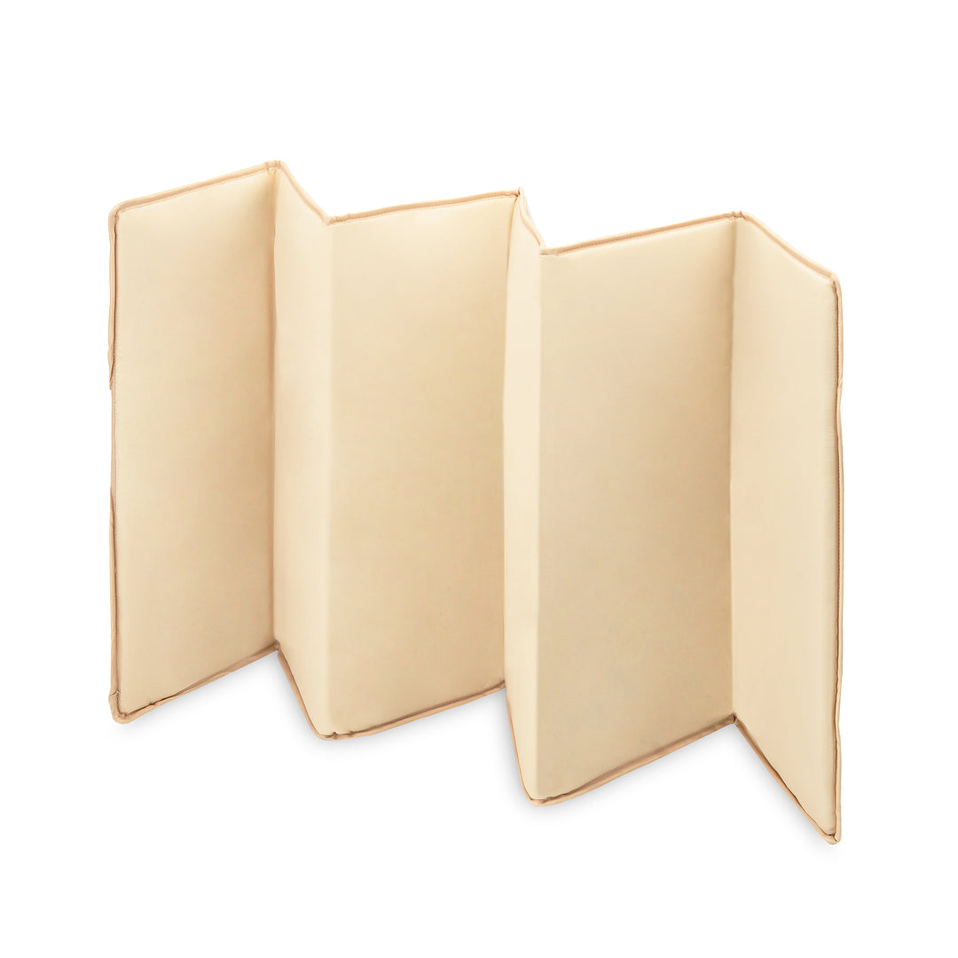 Beige folded fabric on a white background