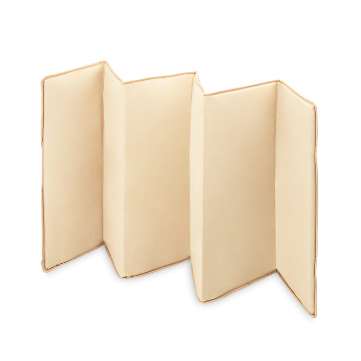 Beige folded fabric on a white background