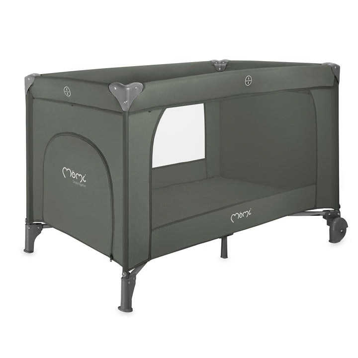 Green travel crib with wheels on a white background