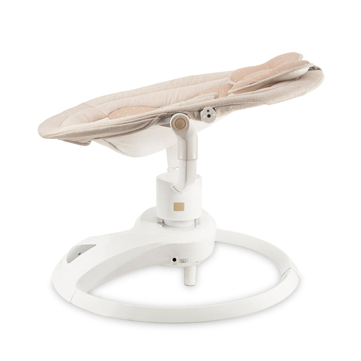 Baby swing with beige seat and white base on a white background