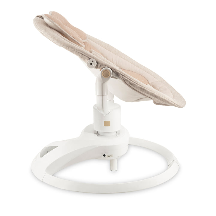 Baby swing with beige seat and white base on a white background