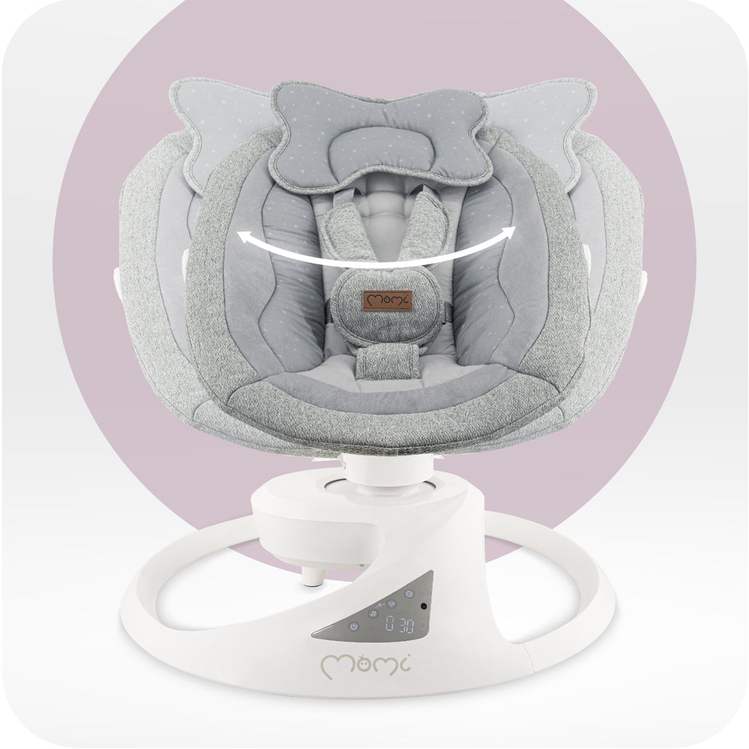 Gray baby swing with white base on a light purple background