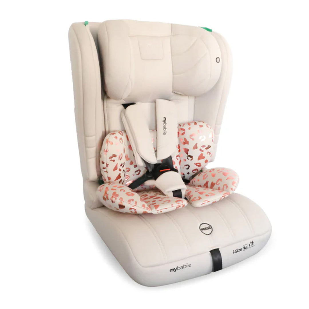 Beige and white car seat with floral patterned straps on a white background