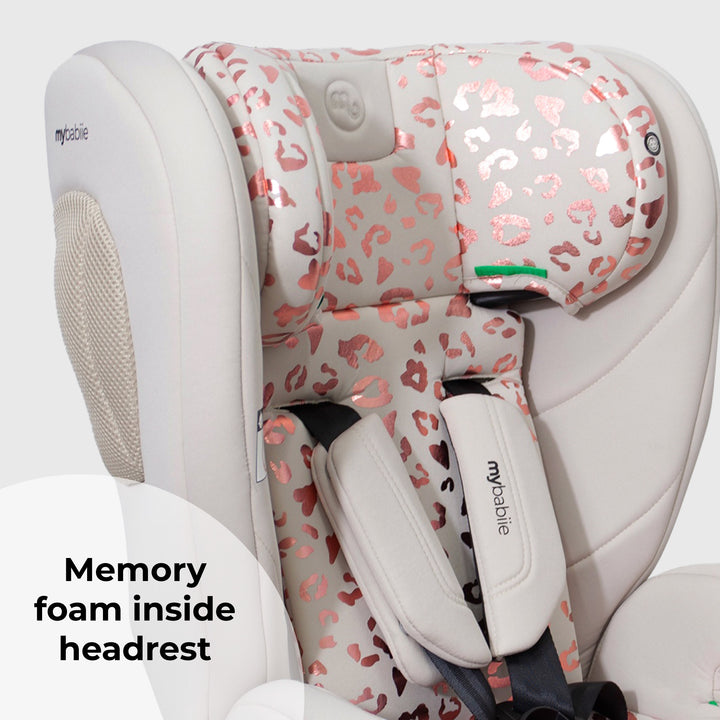 Children's car seat with pink leopard print headrest on a white background