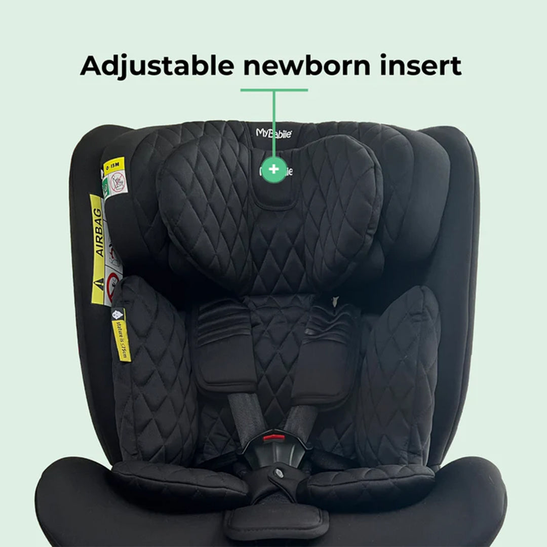 Black car seat with adjustable newborn insert on a light green background