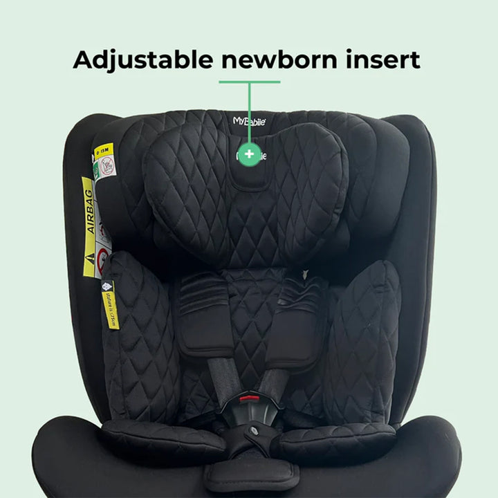 Black car seat with adjustable newborn insert on a light green background