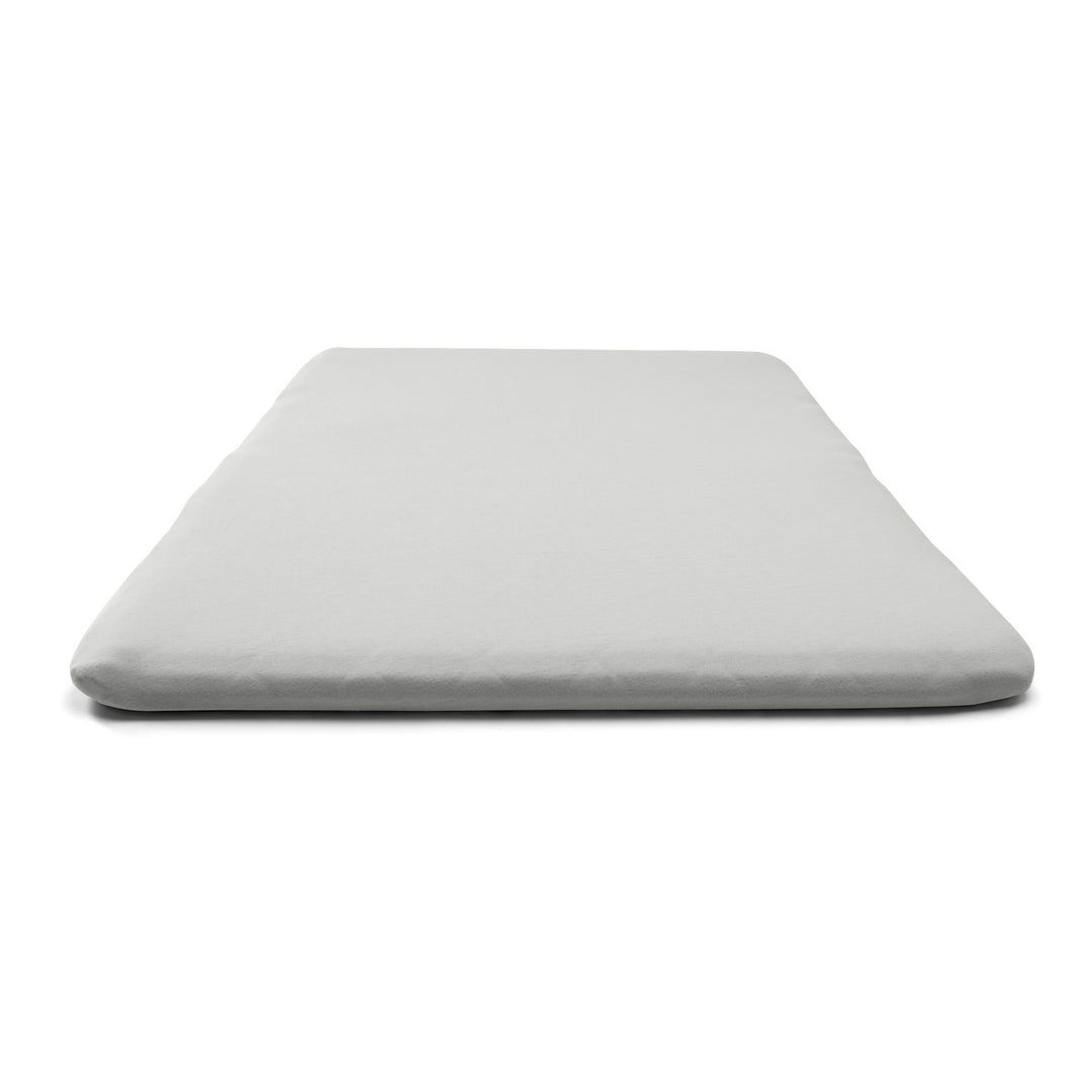 Gray mattress cover on a white background