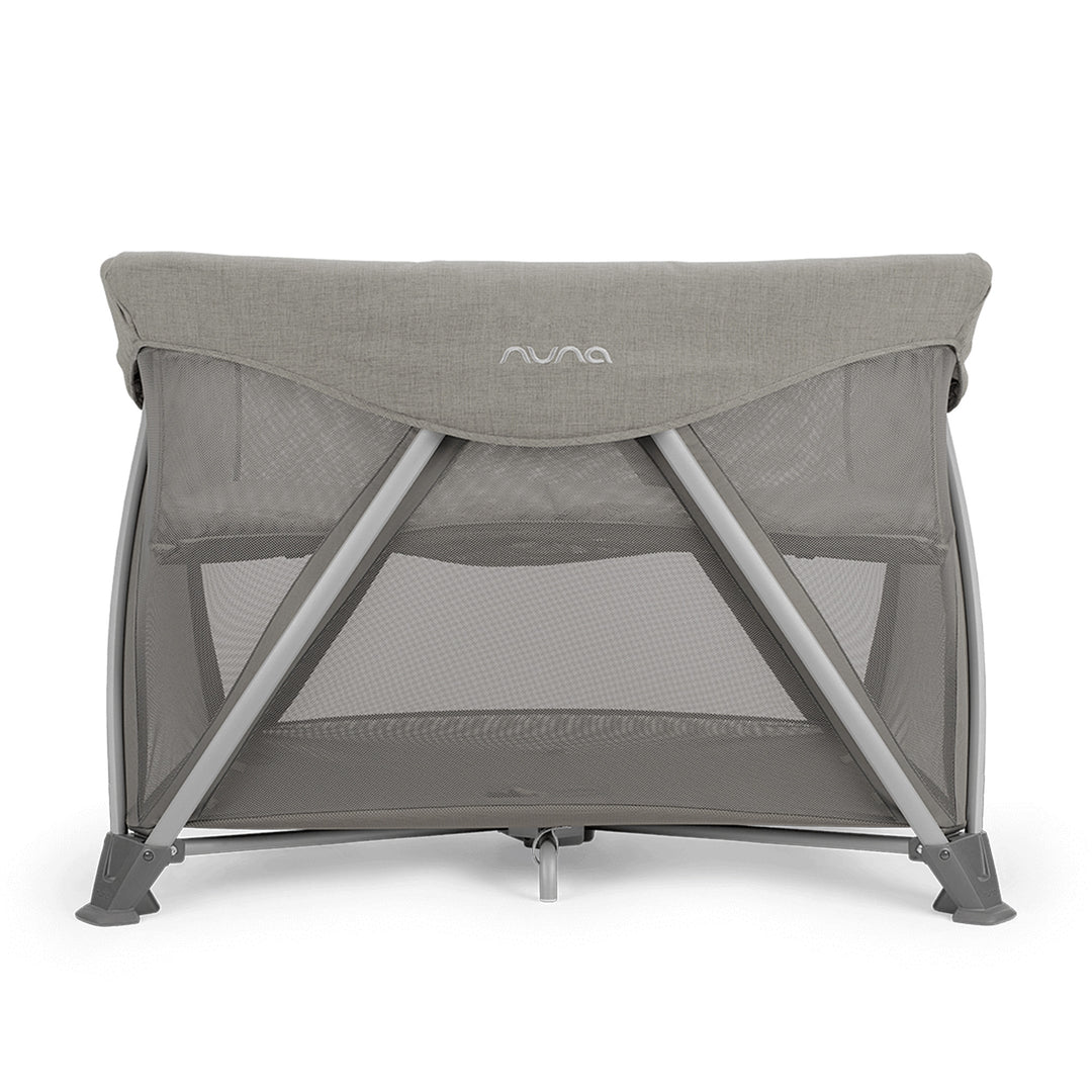 Nuna baby crib with mesh sides on a white background