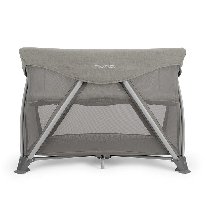 Nuna baby crib with mesh sides on a white background