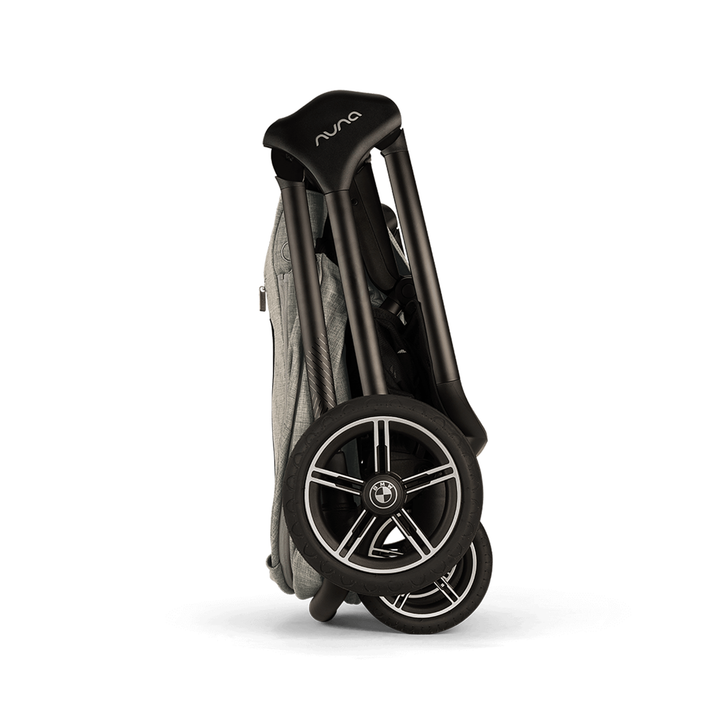 Folded stroller with 'Nuna' branding on a white background