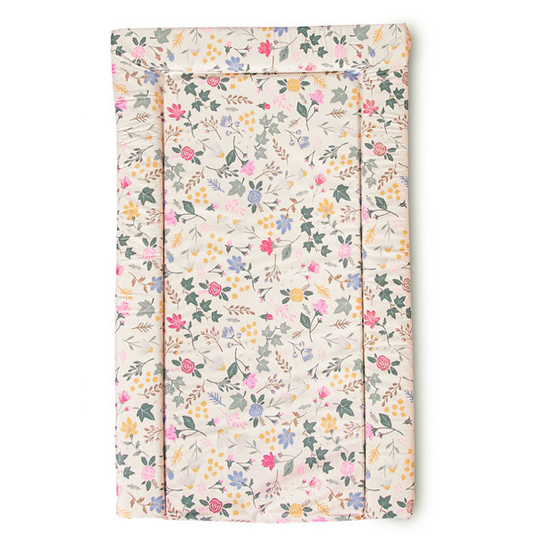 Floral-patterned changing pad on a white background