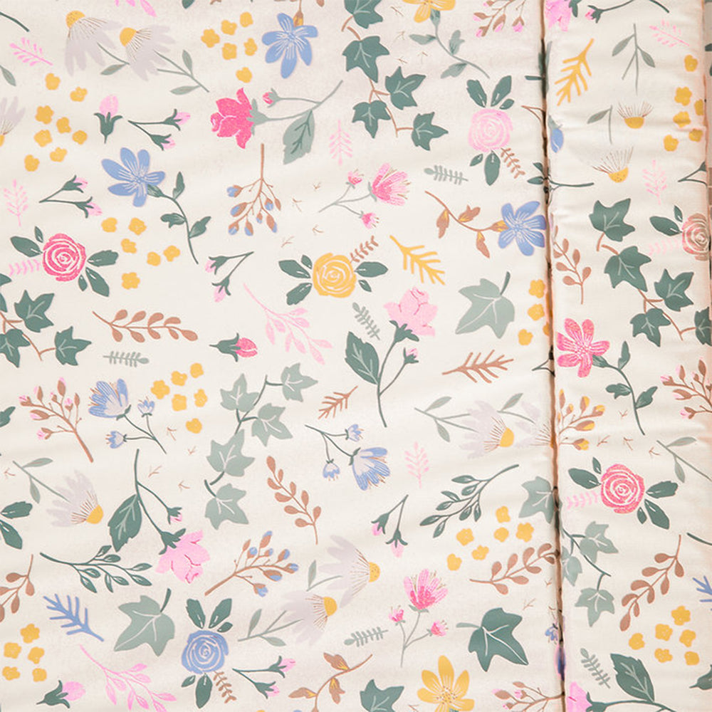 Floral patterned fabric with colorful flowers and leaves on a light background