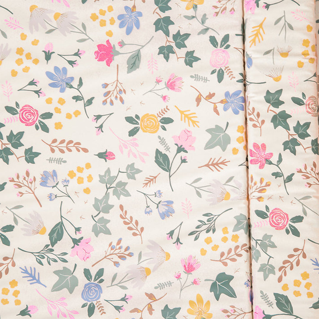 Floral patterned fabric with colorful flowers and leaves on a light background