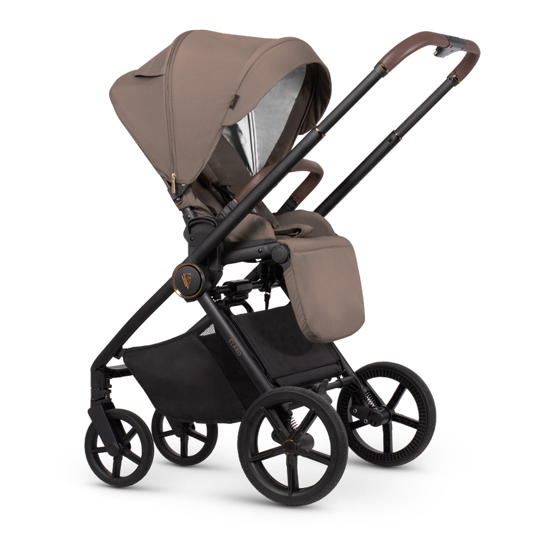Brown and black stroller on a white background