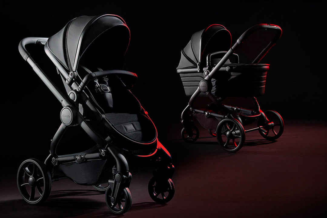 Black baby stroller with red accents on a dark background, featuring the 'iCandy Peach Studio' brand.